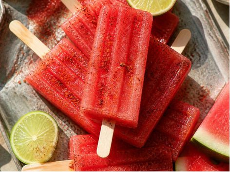 watermelon chile paletass dusted with taj&iacute;n on a summer afternoon